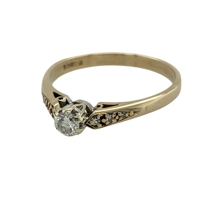 Bring timeless sparkle and elegant styling to your collection with this pre-owned 9ct yellow gold diamond solitaire ring, featuring a classic design with refined detail—perfect for special occasions or everyday sophistication.

Design: The ring showcases a central diamond complemented by smaller diamonds set along the shoulders, creating a balanced and elegant look with added brilliance.