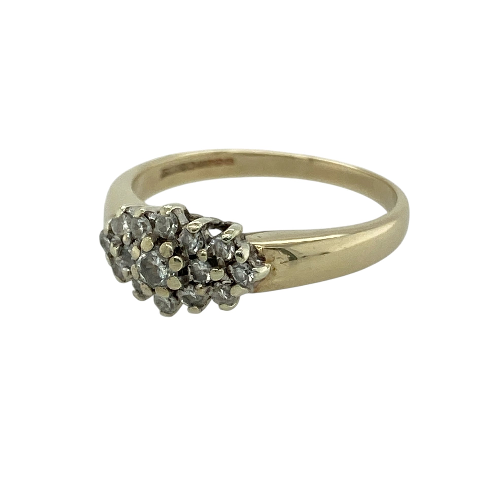 Bring timeless sparkle and elegant styling to your collection with this pre-owned 9ct yellow gold diamond cluster ring, featuring a classic design with impressive brilliance—perfect for special occasions or everyday sophistication.

Design: The ring showcases a cluster-style front measuring approximately 7mm in height, set with sparkling diamonds arranged to create a bright and eye-catching focal point.