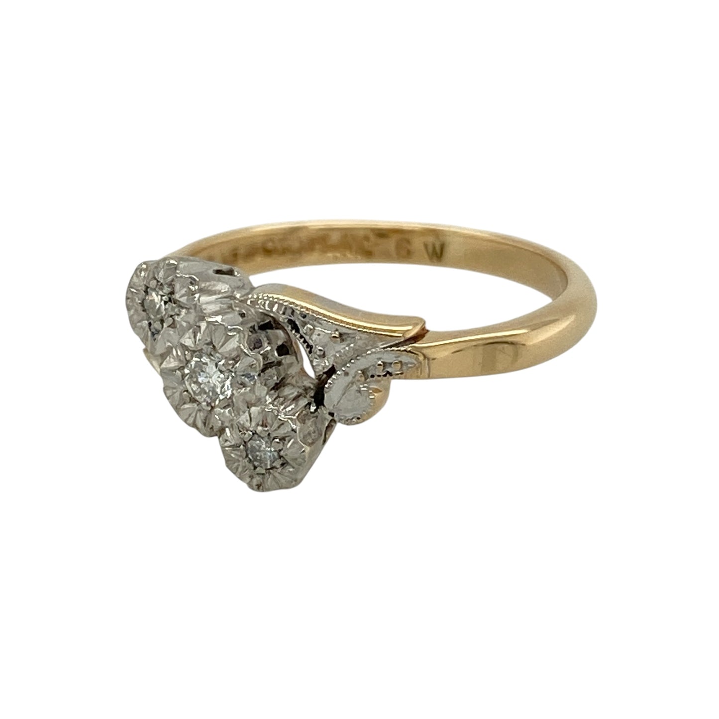 Bring timeless elegance and meaningful sparkle to your collection with this pre-owned 18ct yellow gold and platinum diamond trilogy twist ring, featuring a classic design with refined vintage-inspired detail—perfect for special occasions or everyday sophistication.

Design: The ring showcases a trilogy arrangement of sparkling diamonds within an elegant twist setting, with the front measuring approximately 9mm in height for a graceful and eye-catching appearance.