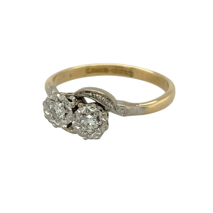 Bring timeless elegance and refined sparkle to your collection with this pre-owned 18ct yellow gold and platinum double diamond twist ring, featuring a classic design with graceful detail—perfect for special occasions or everyday sophistication.

Design: The ring showcases two sparkling diamonds within an elegant twist setting, with the front measuring approximately 7mm in height for a balanced and eye-catching appearance.
