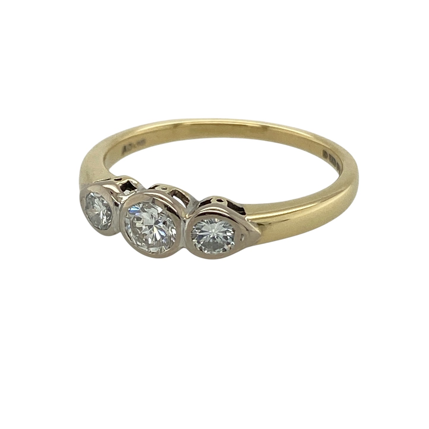 Bring timeless elegance and refined sparkle to your collection with this pre-owned 18ct yellow gold diamond rubover set trilogy ring, featuring a classic design with contemporary detailing—perfect for special occasions or everyday sophistication.

Design: The ring showcases a trilogy arrangement of diamonds in smooth rubover settings, creating a clean and elegant look with a modern finish.