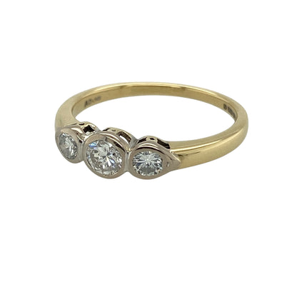 Bring timeless elegance and refined sparkle to your collection with this pre-owned 18ct yellow gold diamond rubover set trilogy ring, featuring a classic design with contemporary detailing—perfect for special occasions or everyday sophistication.

Design: The ring showcases a trilogy arrangement of diamonds in smooth rubover settings, creating a clean and elegant look with a modern finish.