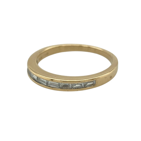 Bring refined sparkle and timeless sophistication to your collection with this pre-owned 18ct yellow gold diamond set band ring, featuring elegant baguette cut diamonds and a classic slim profile—perfect for everyday wear or special occasions.

Design: The ring features a sleek band style measuring approximately 3mm across the front, set with baguette cut diamonds that create a clean and sophisticated linear sparkle.