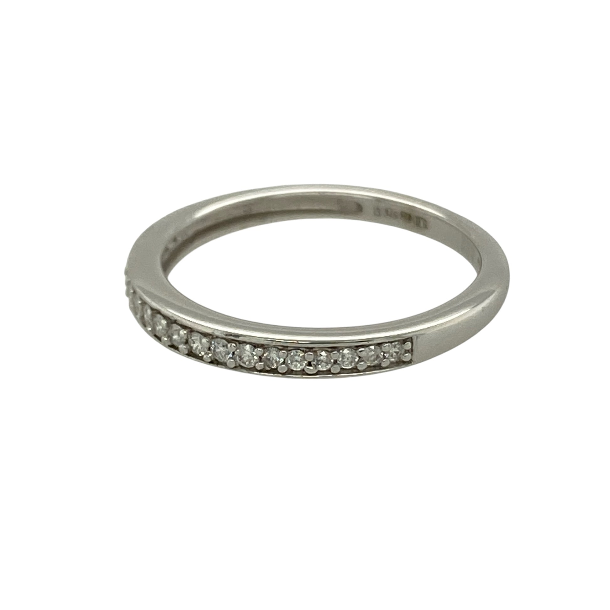 Bring refined sparkle and timeless elegance to your collection with this pre-owned 9ct white gold diamond set band ring, featuring a delicate design with versatile appeal—perfect for everyday wear or stacking with other rings.

Design: The ring features a slim band style measuring approximately 2mm across the front, set with sparkling diamonds that create a subtle yet elegant finish.