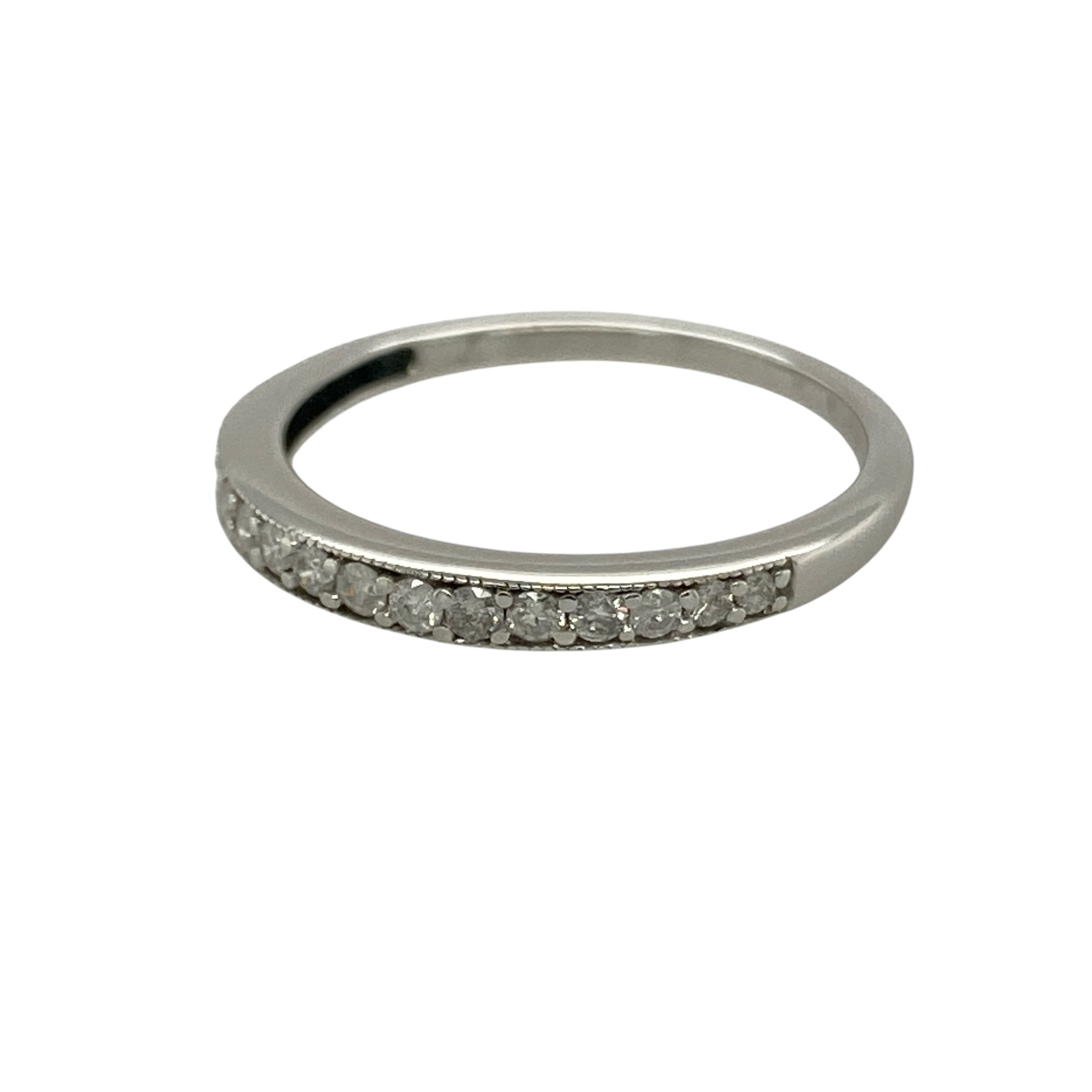 Bring elegant sparkle and timeless simplicity to your collection with this pre-owned 9ct white gold diamond set band ring, featuring a refined design with versatile appeal—perfect for everyday wear or stacking with other rings.

Design: The ring features a slim band style measuring approximately 2mm across the front, set with sparkling diamonds that create a delicate yet eye-catching finish.