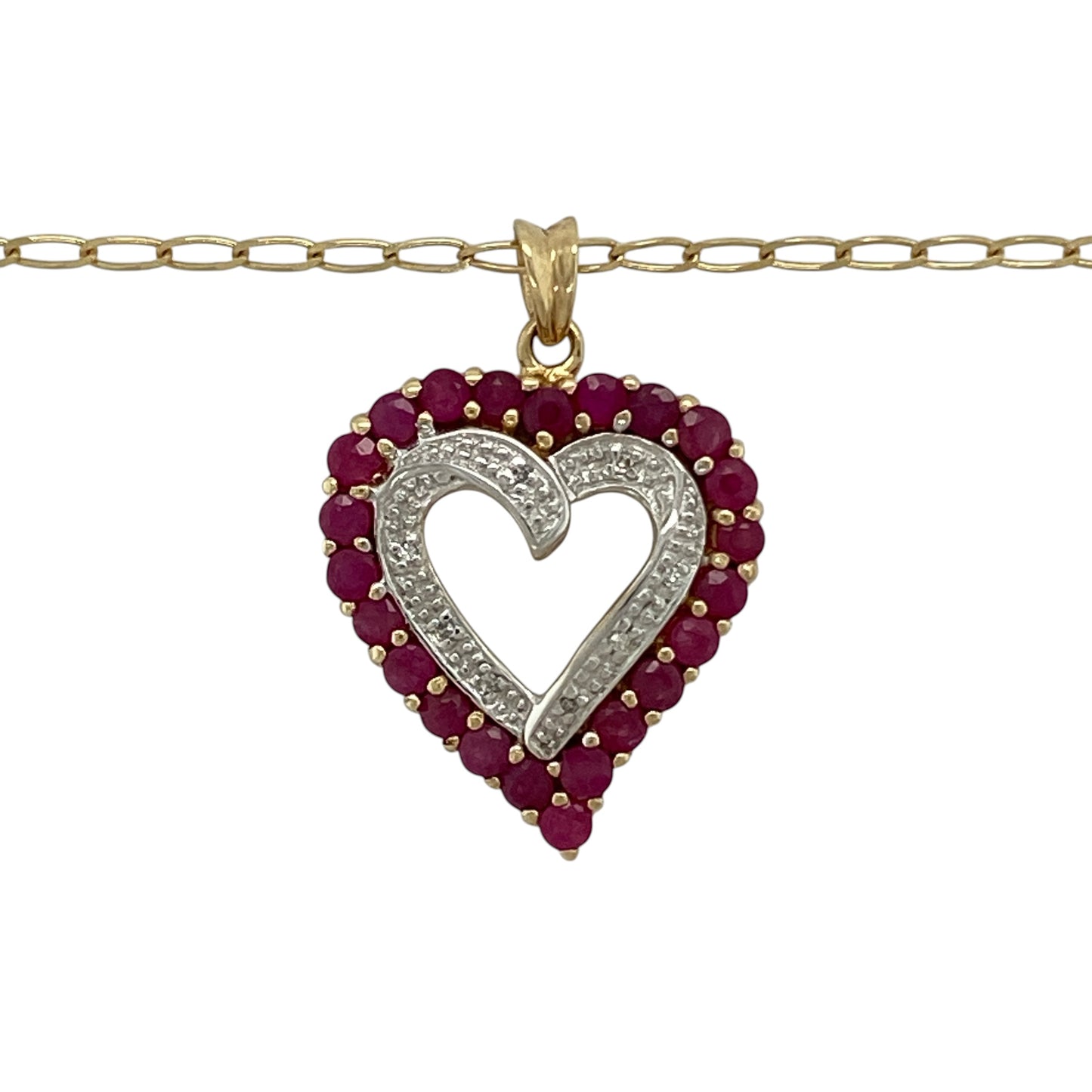 Bring romantic elegance and timeless sparkle to your collection with this pre-owned 9ct yellow gold diamond and ruby open heart pendant necklace, featuring a graceful design with meaningful appeal—perfect for everyday wear or a heartfelt gift.

Design: The necklace features an open heart pendant measuring approximately 2.8cm in length including the bail, accented with vibrant rubies and sparkling diamonds for a striking and feminine finish. The pendant is suspended from an 18" open curb chain.