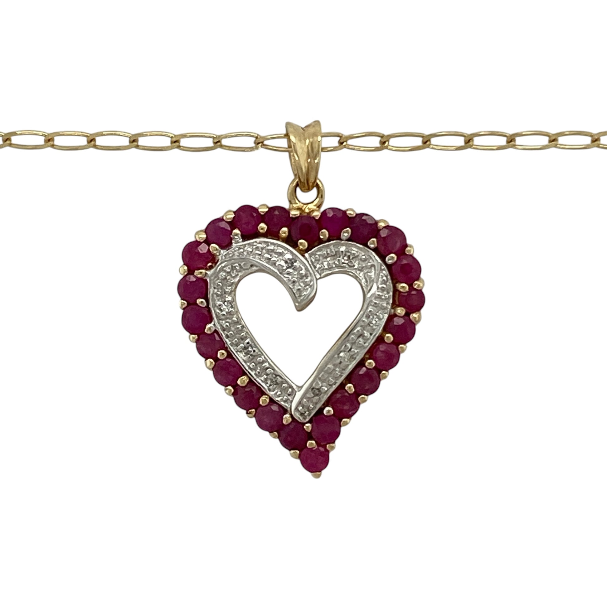 Bring romantic elegance and timeless sparkle to your collection with this pre-owned 9ct yellow gold diamond and ruby open heart pendant necklace, featuring a graceful design with meaningful appeal—perfect for everyday wear or a heartfelt gift.

Design: The necklace features an open heart pendant measuring approximately 2.8cm in length including the bail, accented with vibrant rubies and sparkling diamonds for a striking and feminine finish. The pendant is suspended from an 18" open curb chain.