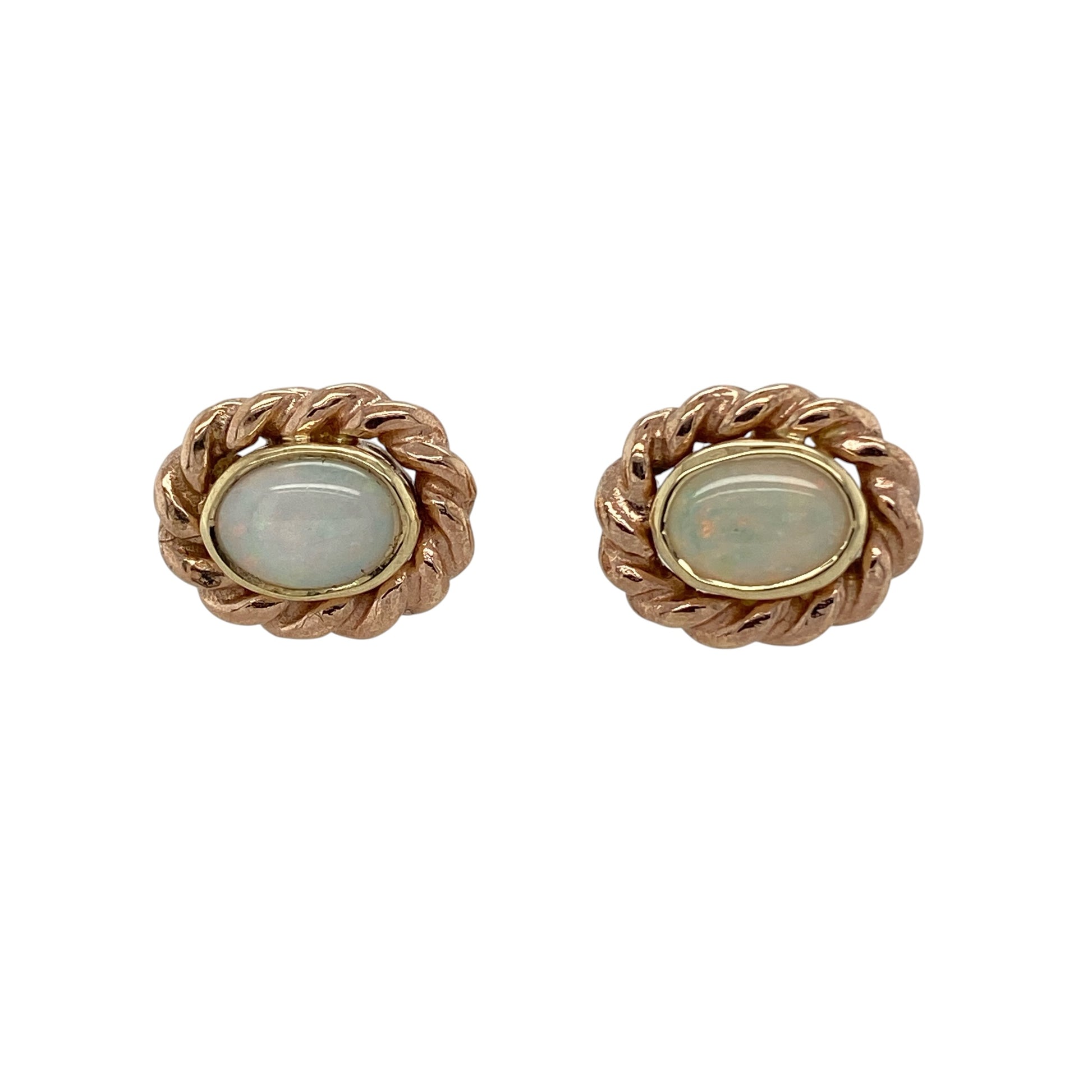 Bring elegant shimmer and timeless Welsh-inspired styling to your collection with these pre-owned 9ct gold opalique set Clogau oval stud earrings, featuring refined detailing with classic appeal—perfect for everyday wear or special occasions.

Design: The earrings feature oval opalique stones measuring approximately 7mm by 5mm each, framed by an intricate rope detail surround that creates a sophisticated and eye-catching finish.