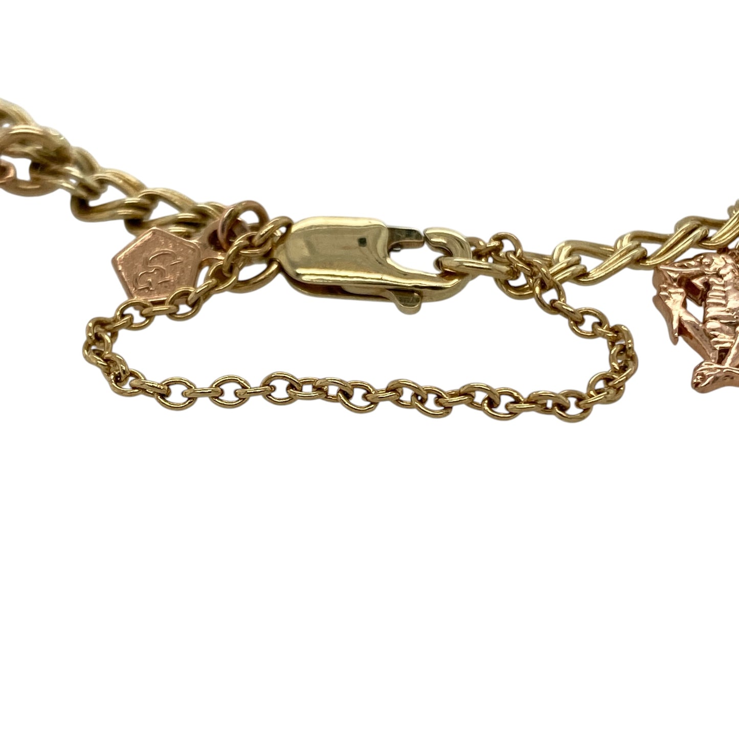Bring meaningful Welsh heritage and timeless charm to your collection with this pre-owned 9ct yellow and rose gold Clogau charm bracelet, featuring an elegant selection of symbolic charms with classic appeal—perfect as a treasured keepsake or standout statement piece.

Design: The bracelet features a collection of authentic Clogau charms including a lovespoon, mouse, Wales charm, Cariad heart, Welsh dragon, and harp, all suspended from a classic charm bracelet