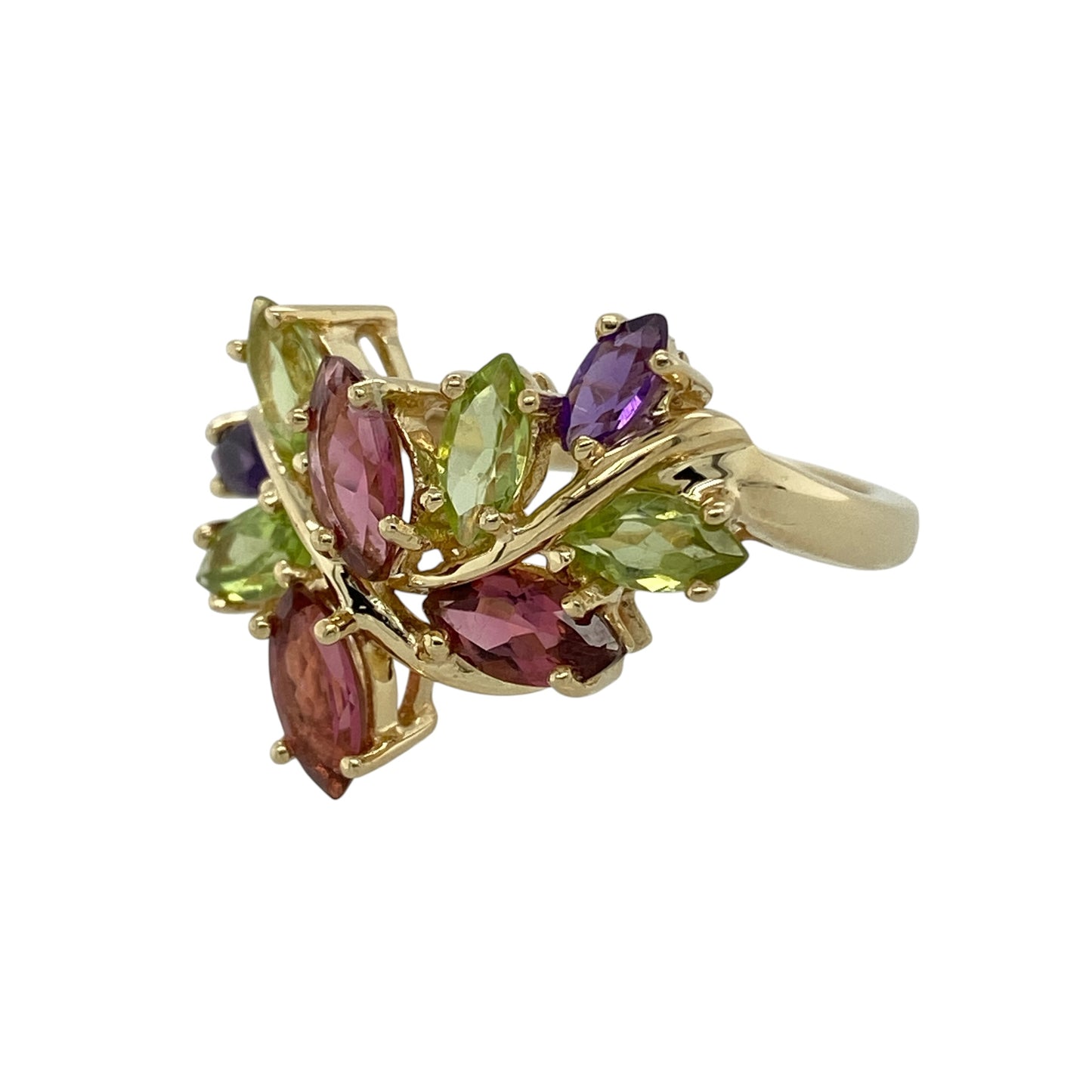 Bring vibrant colour and nature-inspired elegance to your collection with this pre-owned 9ct yellow gold gemstone leaf style ring, featuring a bold floral design with eye-catching detail—perfect for special occasions or statement everyday wear.

Design: The ring showcases an elaborate leaf-inspired design measuring approximately 1.9cm in height, set with marquise cut rubies, peridot, and amethyst stones arranged to create a colourful and flowing botanical effect.
