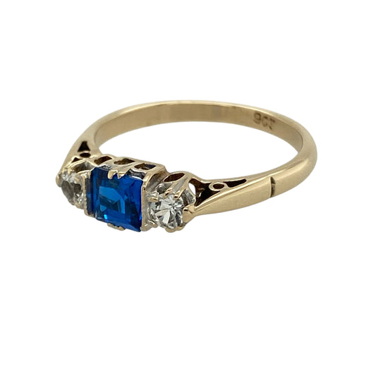 Bring timeless elegance and vibrant sparkle to your collection with this pre-owned 9ct yellow gold sapphire-coloured stone and cubic zirconia trilogy ring, featuring a classic design with refined detail—perfect for everyday wear or special occasions.

Design: The ring showcases a square sapphire-coloured centre stone measuring approximately 4mm by 4mm, flanked by two sparkling cubic zirconia stones measuring approximately 3mm in diameter each in a timeless trilogy arrangement.