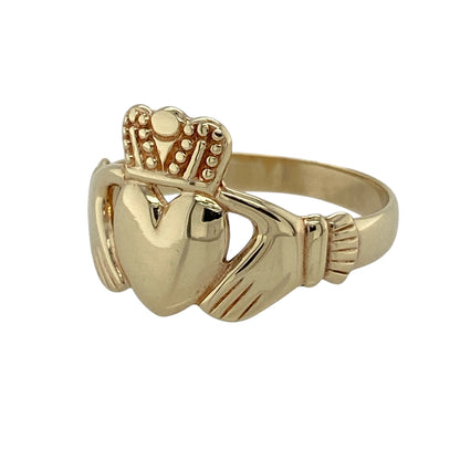 Celebrate heritage, loyalty, and timeless style with this pre-owned 9ct yellow gold Claddagh ring, featuring the iconic traditional Irish design—perfect as a meaningful gift, friendship ring, or everyday piece of sentimental jewellery.

Design: The ring features the classic Claddagh motif with two hands holding a crowned heart, symbolising love, loyalty, and friendship. The detailed front design measures approximately 14mm high, giving the ring a bold and eye-catching appearance.
