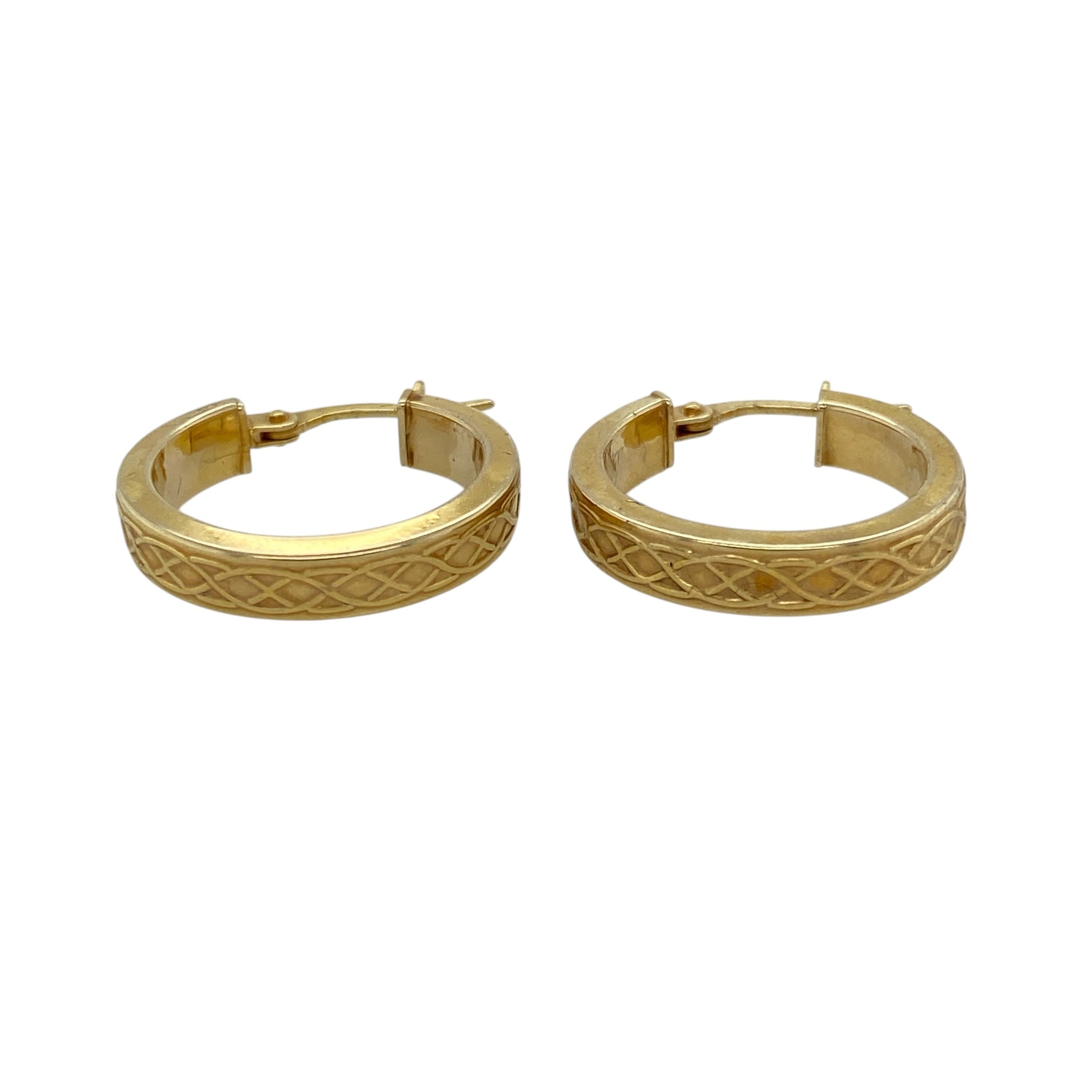 Add timeless Celtic-inspired style to your jewellery collection with these pre-owned 9ct yellow gold Celtic weave hoop creole earrings, featuring intricate woven detailing and a classic hoop design—perfect for everyday wear or adding a touch of heritage-inspired elegance to any outfit.

Design: The earrings feature a traditional hoop creole style with detailed Celtic weave patterning throughout, creating an eye-catching and elegant textured appearance.