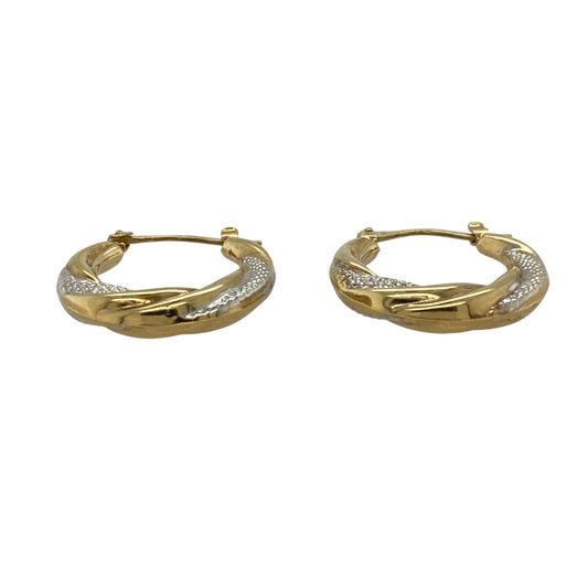Add elegant two-tone style to your jewellery collection with these pre-owned 9ct yellow and white gold twisted textured hoop creole earrings, featuring a timeless hoop design with eye-catching detail—perfect for everyday wear or effortless occasion styling.

Design: The earrings feature a classic hoop creole style with twisted textured detailing, combining yellow and white gold tones for a striking and versatile two-tone appearance.