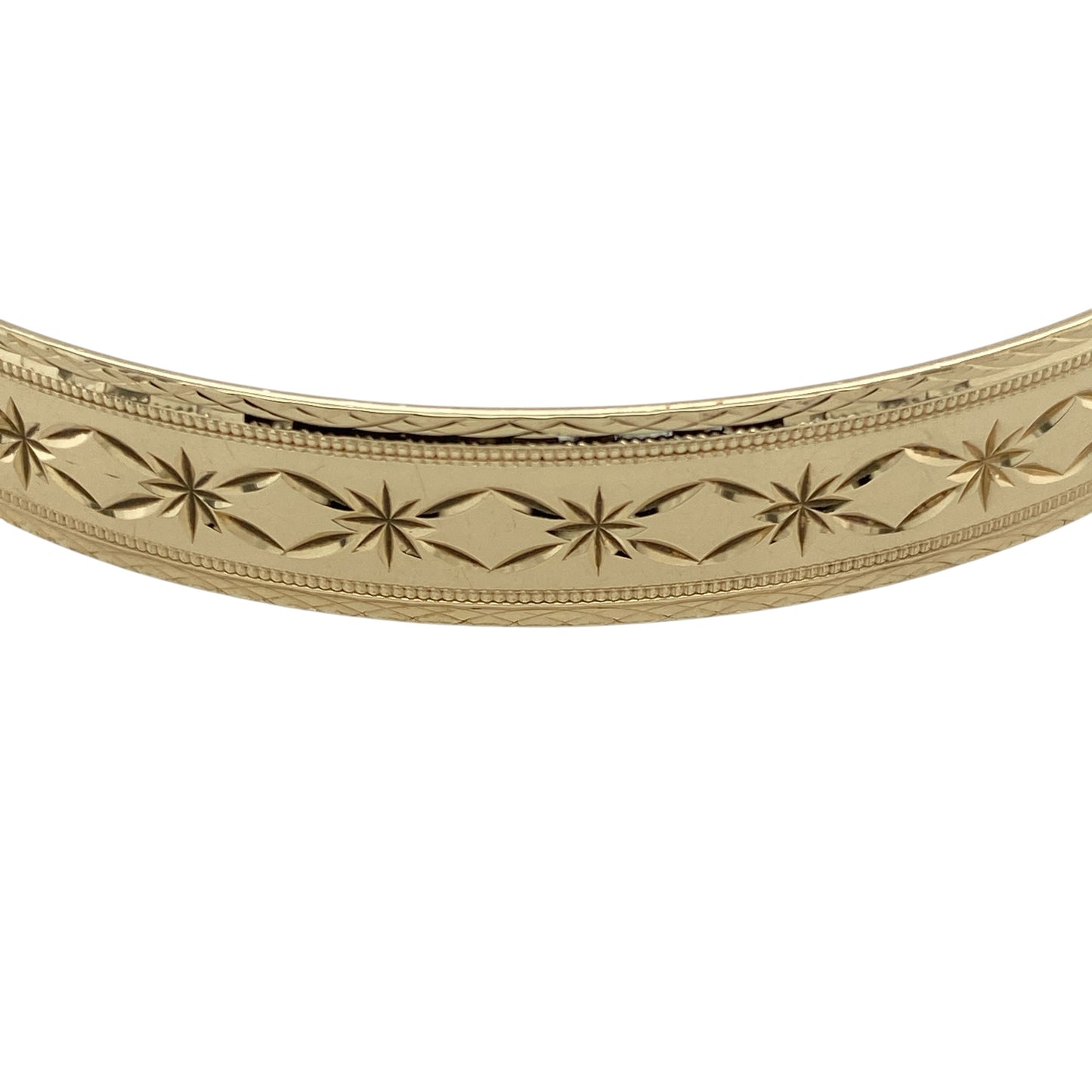 Add timeless elegance to your jewellery collection with this pre-owned 9ct yellow solid gold patterned bangle, featuring detailed decorative styling and a classic polished finish—perfect for everyday luxury, occasion wear, or stacking with other gold jewellery pieces.

Design: The bangle features an attractive patterned finish throughout, creating a stylish textured appearance with timeless appeal. Measuring approximately 9mm wide, the design offers a bold and elegant presence on the wrist.