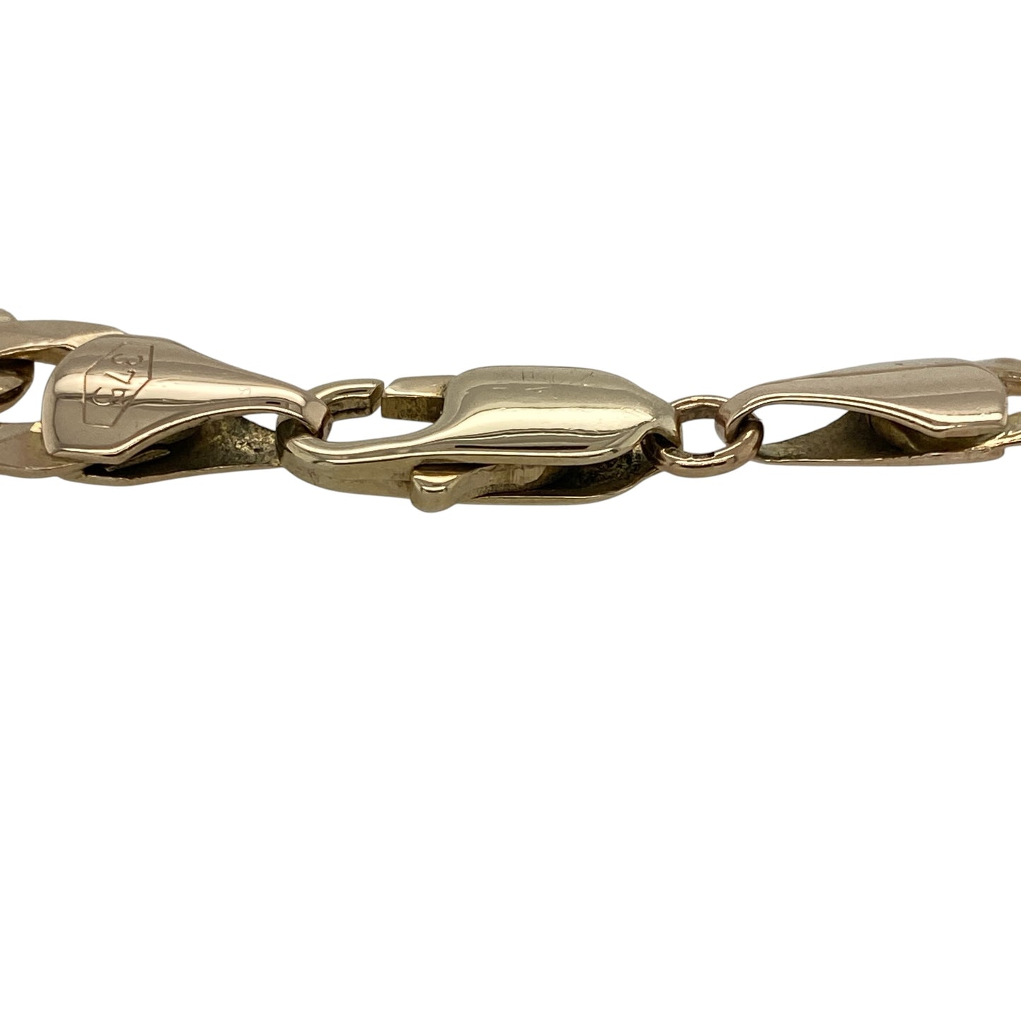 Make a bold statement with this pre-owned 9ct yellow gold curb bracelet, featuring a classic heavyweight link design with timeless masculine appeal—perfect for everyday wear, layering, or adding to a fine jewellery collection.

Design: The bracelet features traditional curb links with a smooth polished finish, creating a strong and eye-catching look. The links measure approximately 9mm wide, giving the bracelet a bold and substantial appearance on the wrist.