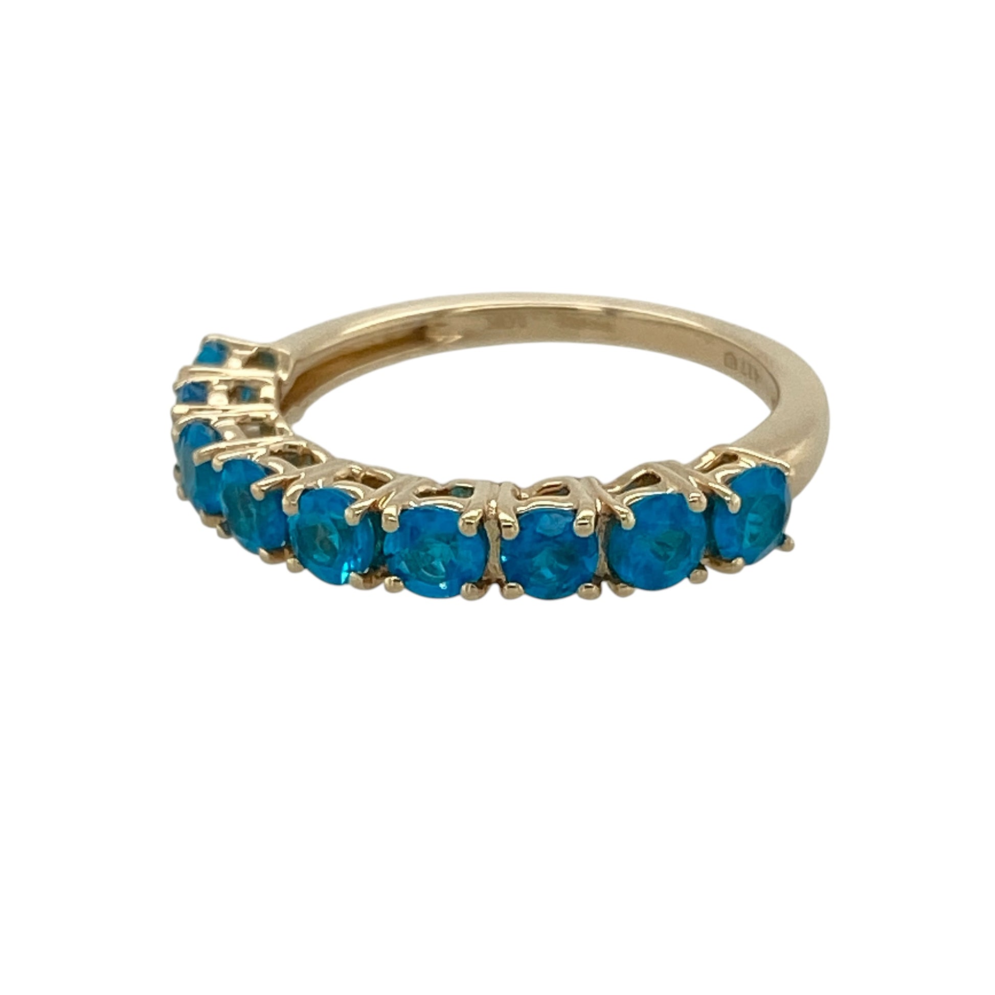 Add a touch of vibrant colour to your jewellery collection with this pre-owned 9ct yellow gold blue stone set band ring, featuring a classic multi-stone design with timeless everyday appeal—perfect for stacking, special occasions, or elegant daily wear.

Design: The ring features a row of sparkling blue stones, each measuring approximately 3mm in diameter, creating a refined and eye-catching band design with rich colour and subtle brilliance.