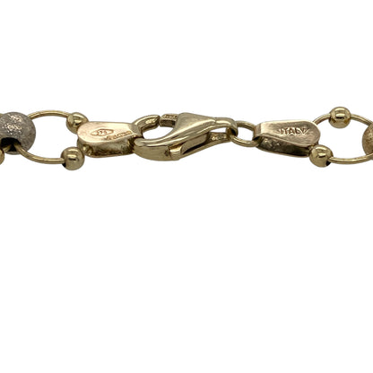 Add eye-catching sparkle and elegant colour to your jewellery collection with this pre-owned 9ct yellow gold sparkle ball round link bracelet, featuring a striking multi-tone design with timeless everyday appeal—perfect for occasion wear, gifting, or standout styling.

Design: The bracelet features bold round links measuring approximately 8mm wide, accented with textured sparkle balls in yellow, white, and rose gold tones, creating a stylish tri-colour effect with beautiful light-catching detail.
