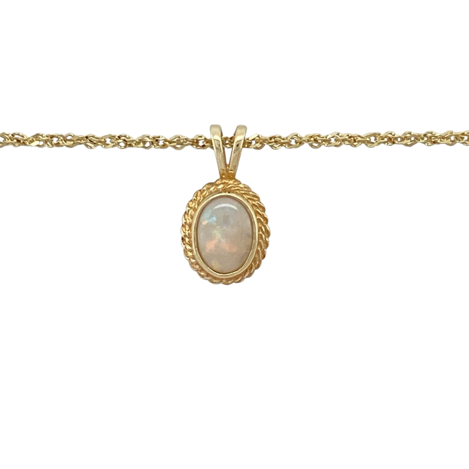 Add elegant shimmer and vintage-inspired charm to your jewellery collection with this pre-owned 9ct yellow gold opalique pendant necklace, featuring a luminous oval stone with a classic rope edge surround—perfect for everyday elegance, special occasions, or thoughtful gifting.

Design: The necklace features an oval opalique stone measuring approximately 7mm by 5mm, framed by an attractive rope edge surround that adds texture and timeless character.