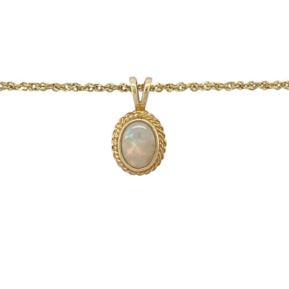 Add elegant shimmer and vintage-inspired charm to your jewellery collection with this pre-owned 9ct yellow gold opalique pendant necklace, featuring a luminous oval stone with a classic rope edge surround—perfect for everyday elegance, special occasions, or thoughtful gifting.

Design: The necklace features an oval opalique stone measuring approximately 7mm by 5mm, framed by an attractive rope edge surround that adds texture and timeless character.