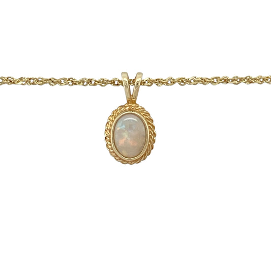 Add elegant shimmer and vintage-inspired charm to your jewellery collection with this pre-owned 9ct yellow gold opalique pendant necklace, featuring a luminous oval stone with a classic rope edge surround—perfect for everyday elegance, special occasions, or thoughtful gifting.

Design: The necklace features an oval opalique stone measuring approximately 7mm by 5mm, framed by an attractive rope edge surround that adds texture and timeless character.