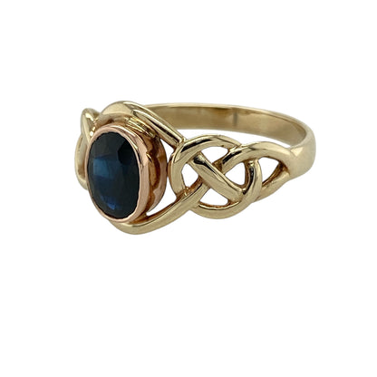 Add timeless Celtic-inspired elegance to your jewellery collection with this pre-owned 9ct yellow and rose gold sapphire Clogau ring, featuring intricate detailing and a rich blue gemstone with classic everyday appeal—perfect for special occasions, gifting, or meaningful wear.

Design: The ring showcases a striking oval sapphire stone measuring approximately 7mm by 5mm, complemented by elegant Celtic-inspired detailing and contrasting yellow and rose gold tones for a distinctive and eye-catching appearance.