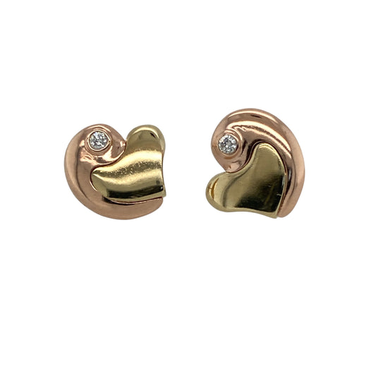 Add romantic elegance to your jewellery collection with these pre-owned 9ct yellow and rose gold diamond heart Clogau stud earrings, featuring timeless two-tone styling with delicate diamond sparkle—perfect for gifting, special occasions, or everyday sophistication.

Design: The earrings feature elegant heart-shaped stud designs with contrasting yellow and rose gold detailing, accented with sparkling diamonds for a refined and feminine appearance.
