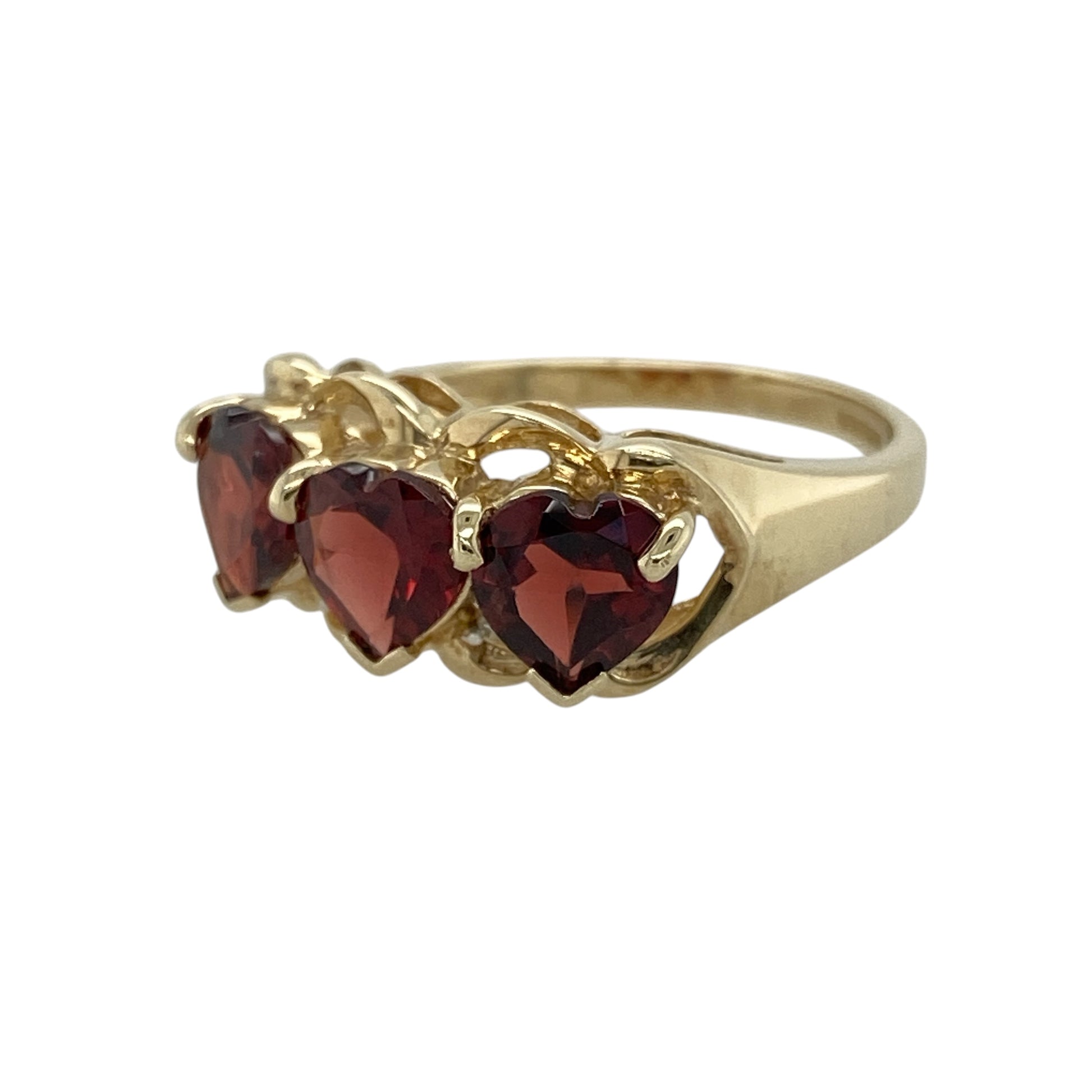 Add romantic colour and timeless elegance to your jewellery collection with this pre-owned 9ct yellow gold diamond and garnet heart band ring, featuring striking heart-cut gemstones with delicate diamond detail—perfect for special occasions, meaningful gifting, or standout everyday wear.

Design: The ring showcases three heart-cut garnet stones, each measuring approximately 6mm, creating a bold and feminine band design enhanced by delicate diamond accents for added sparkle.