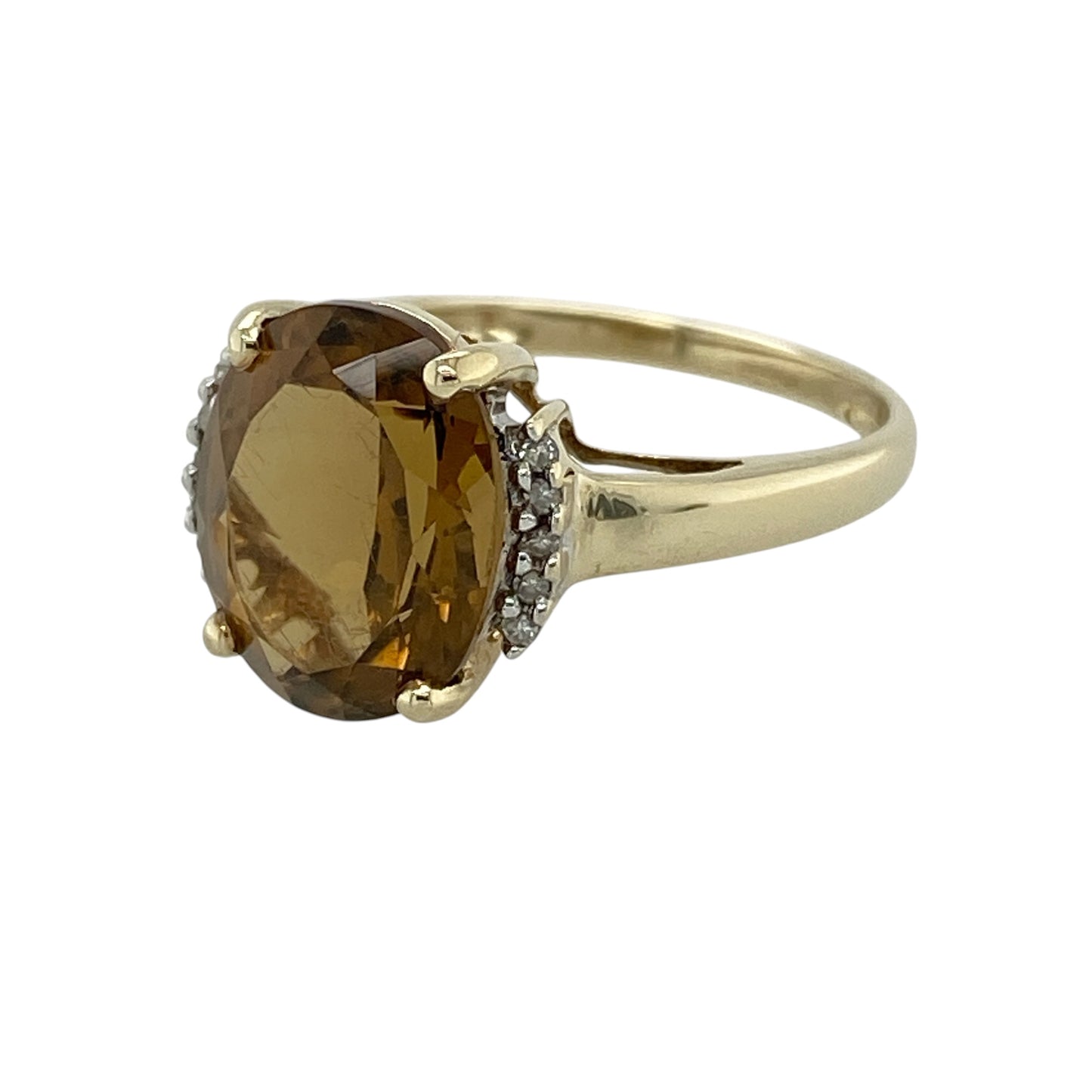 Add vibrant colour and elegant sparkle to your jewellery collection with this pre-owned 9ct yellow gold diamond and yellow stone ring, featuring a striking oval-cut centre stone with timeless appeal—perfect for occasion wear, gifting, or adding a bold touch to everyday styling.

Design: The ring showcases a large oval yellow stone measuring approximately 11mm by 9mm, complemented by delicate diamond accents that enhance the brilliance and create an eye-catching, elegant look.
