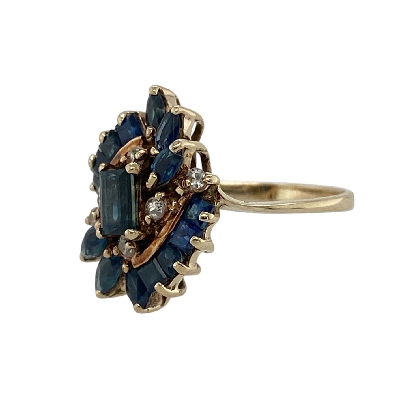 Add striking colour and vintage-inspired elegance to your jewellery collection with this pre-owned 9ct yellow gold diamond and sapphire cluster ring, featuring an eye-catching multi-shape gemstone design with timeless sparkle—perfect for special occasions, statement styling, or sophisticated everyday wear.

Design: The ring features a bold cluster arrangement of sapphires in a mix of rectangular, marquise, and square cuts, creating a unique and elegant design enhanced by sparkling diamond accents.