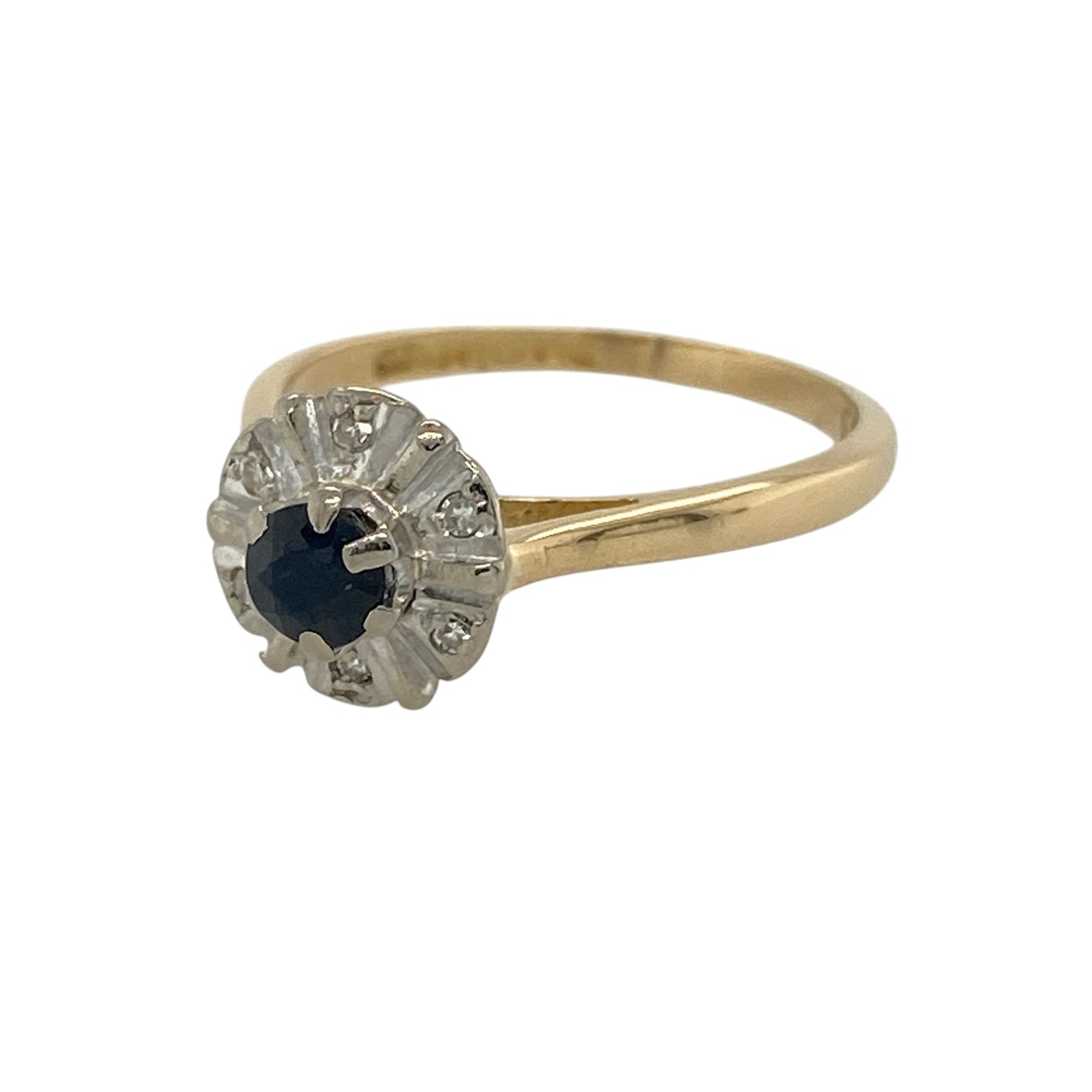 Add timeless elegance and refined sparkle to your jewellery collection with this pre-owned 18ct yellow gold diamond and sapphire ring, featuring a classic gemstone design with luxurious white gold detailing—perfect for special occasions, gifting, or sophisticated everyday wear.

Design: The ring showcases a rich blue sapphire centre stone measuring approximately 4mm in diameter, surrounded by sparkling diamonds set within contrasting white gold for an elegant and eye-catching finish.