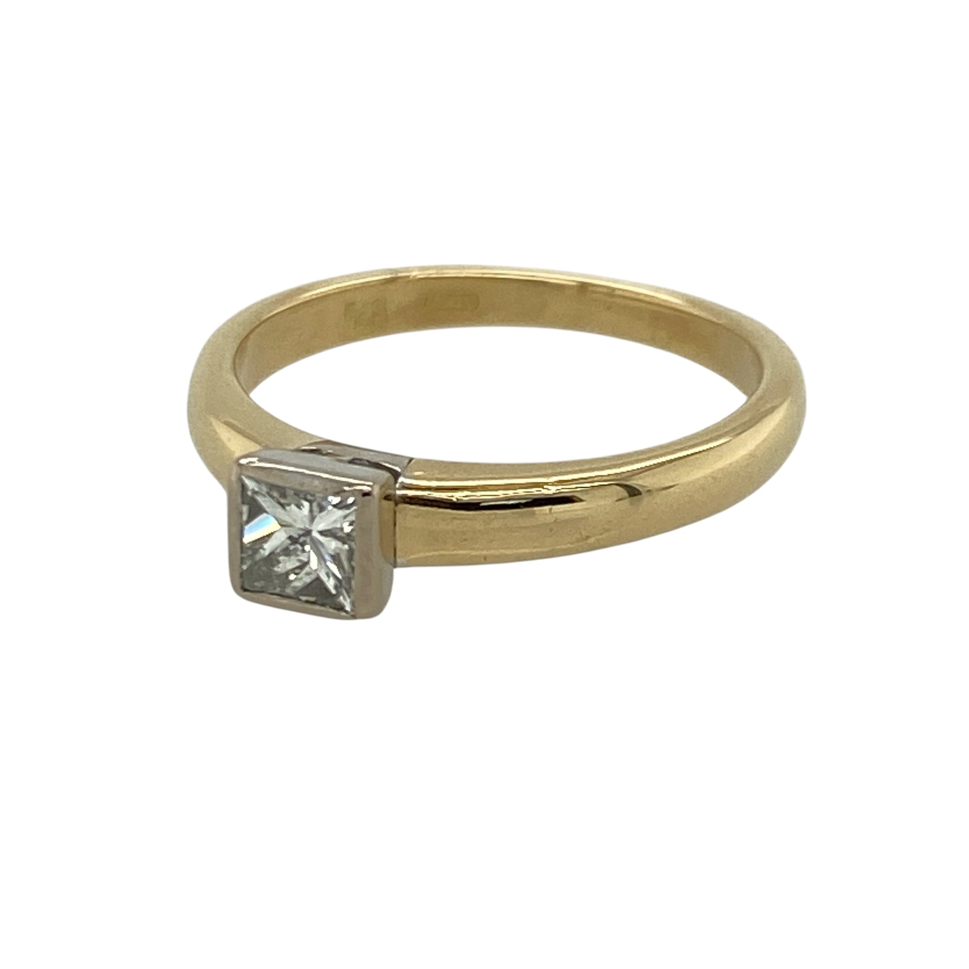 Add timeless elegance and refined sparkle to your jewellery collection with this pre-owned 18ct yellow gold princess cut diamond solitaire ring, featuring a classic single stone design with sophisticated everyday appeal—perfect for engagements, special occasions, or luxurious daily wear.

Design: The ring showcases a striking princess cut diamond in a timeless solitaire setting, creating a clean and elegant look with beautiful light-catching brilliance.