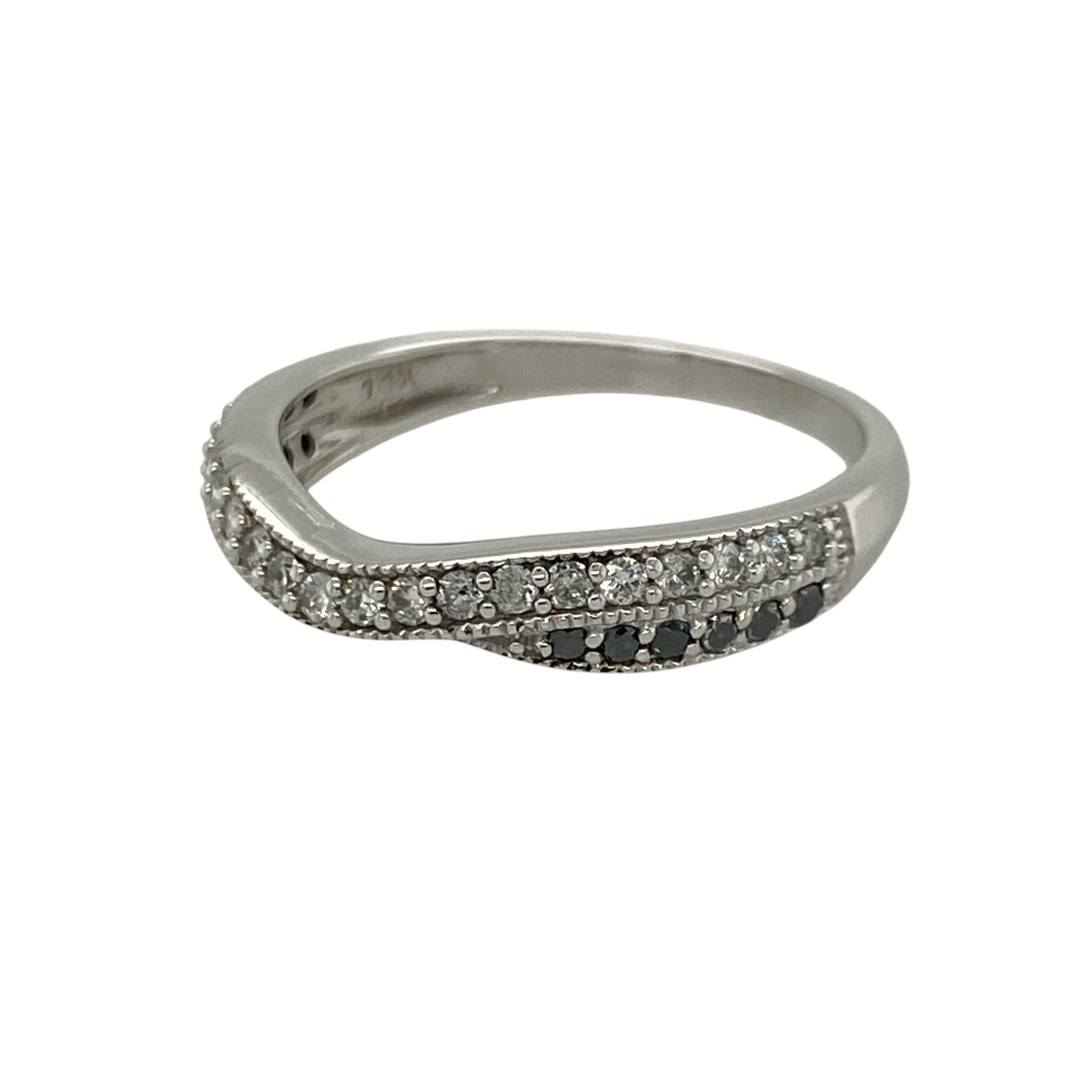 Add contemporary elegance to your jewellery collection with this pre-owned 14ct white gold white and black diamond wishbone style ring, featuring a striking contrast of diamonds in a timeless shaped design—perfect for stacking, special occasions, or sophisticated everyday wear.

Design: The ring features a stylish wishbone-inspired band design measuring approximately 4mm wide at the front, accented with contrasting white and black diamonds for a bold and eye-catching appearance.