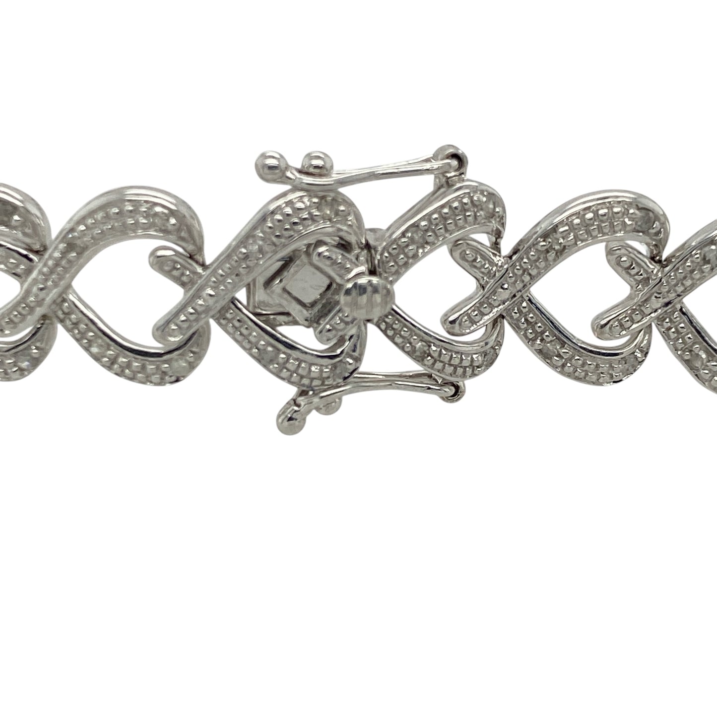 Add romantic elegance and luxurious sparkle to your jewellery collection with this pre-owned 9ct white gold diamond heart link bracelet, featuring a bold statement design with timeless feminine appeal—perfect for special occasions, gifting, or sophisticated everyday wear.

Design: The bracelet features beautifully detailed heart-shaped links accented with sparkling diamonds, creating an eye-catching and elegant design with timeless charm.