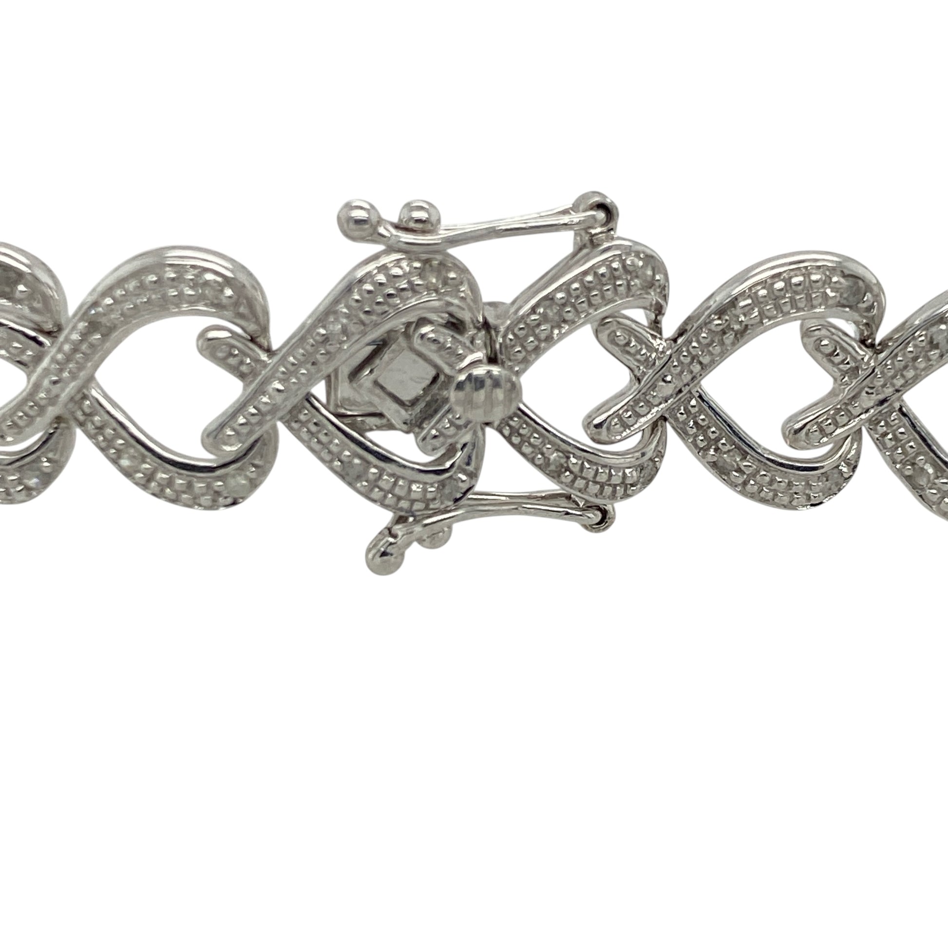 Add romantic elegance and luxurious sparkle to your jewellery collection with this pre-owned 9ct white gold diamond heart link bracelet, featuring a bold statement design with timeless feminine appeal—perfect for special occasions, gifting, or sophisticated everyday wear.

Design: The bracelet features beautifully detailed heart-shaped links accented with sparkling diamonds, creating an eye-catching and elegant design with timeless charm.
