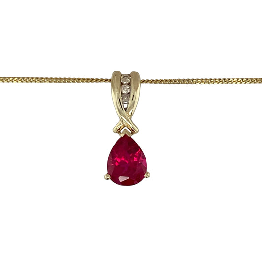 Add elegant colour and timeless sparkle to your jewellery collection with this pre-owned 9ct yellow gold diamond and ruby coloured stone pendant necklace, featuring a graceful teardrop design with classic everyday appeal—perfect for special occasions, gifting, or sophisticated daily wear.

Design: The necklace features a beautiful teardrop-shaped ruby coloured stone measuring approximately 9mm by 7mm, accented with sparkling diamond detailing for an elegant and eye-catching finish.