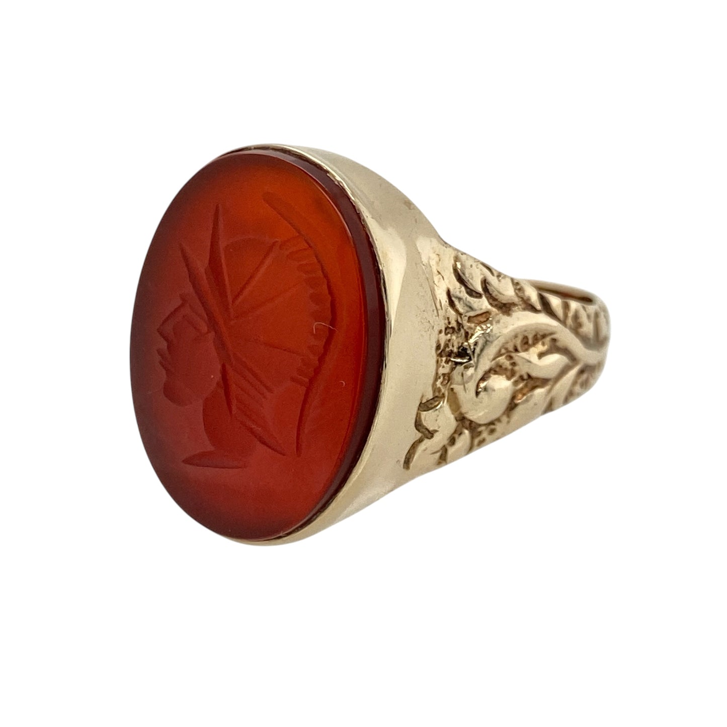 Add bold vintage-inspired character to your jewellery collection with this pre-owned 9ct yellow gold carnelian Centurion oval signet ring, featuring a striking statement gemstone with detailed patterned shoulders—perfect for collectors, statement wear, or classic jewellery styling.

Design: The ring showcases a large oval carnelian stone measuring approximately 20mm by 15mm, featuring an impressive Centurion-style design that creates a bold and eye-catching focal point.