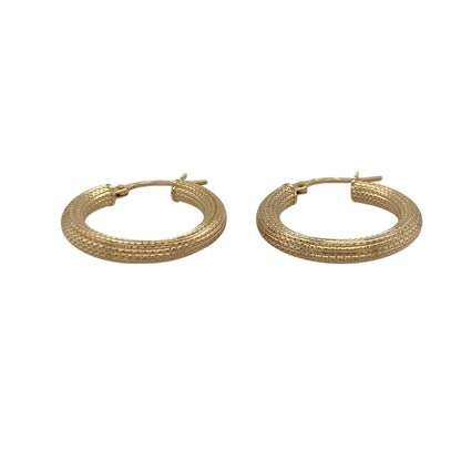 Add timeless style and subtle sparkle to your jewellery collection with these pre-owned 9ct yellow gold textured hoop creole earrings, featuring a classic hoop design with elegant detailing—perfect for everyday wear, occasion styling, or effortless gifting.

Design: The earrings feature a traditional hoop creole design with a textured finish that catches the light beautifully, creating a refined and eye-catching look.