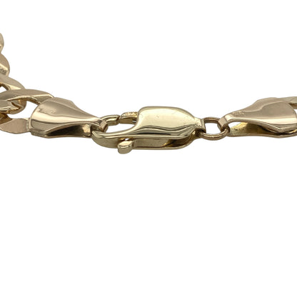 Add bold timeless style to your jewellery collection with this pre-owned 9ct yellow gold curb bracelet, featuring a substantial link design with classic everyday appeal—perfect for statement wear, gifting, or adding a luxurious touch to any outfit.

Design: The bracelet features traditional curb links with a smooth polished finish, creating a strong and eye-catching look. The links measure approximately 10mm wide, giving the bracelet a bold and impressive presence on the wrist.