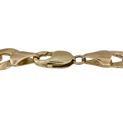 Add bold luxury and timeless style to your jewellery collection with this pre-owned 9ct yellow gold curb bracelet, featuring a heavyweight link design with impressive everyday appeal—perfect for statement wear, gifting, or adding a standout piece to any fine jewellery collection.

Design: The bracelet features traditional curb links with a smooth polished finish, creating a strong and eye-catching look.