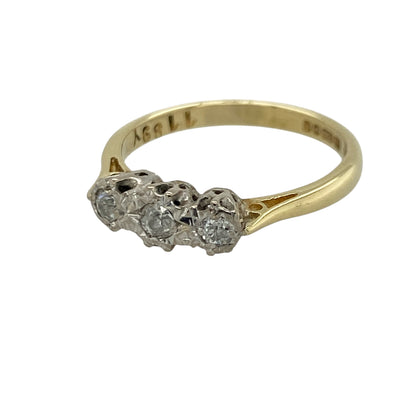 Add timeless sparkle and classic elegance to your jewellery collection with this pre-owned 18ct yellow gold diamond set trilogy ring, featuring a beautifully balanced three-stone design with enduring appeal—perfect for anniversaries, special occasions, or sophisticated everyday wear.

Design: The ring showcases three sparkling diamonds arranged in a traditional trilogy setting, creating a refined and elegant look with approximately 0.20ct of total diamond content.