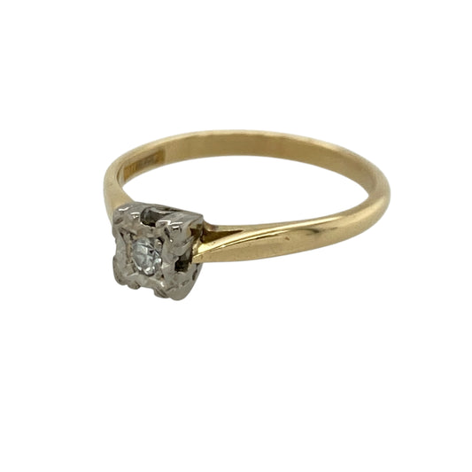 Add timeless sparkle and elegant sophistication to your jewellery collection with this pre-owned 18ct yellow gold diamond illusion set solitaire ring, featuring a classic single stone design with striking two-tone detailing—perfect for engagements, special occasions, or luxurious everyday wear.

Design: The ring showcases a sparkling brilliant cut diamond in an illusion setting, designed to enhance the appearance and brilliance of the centre stone.