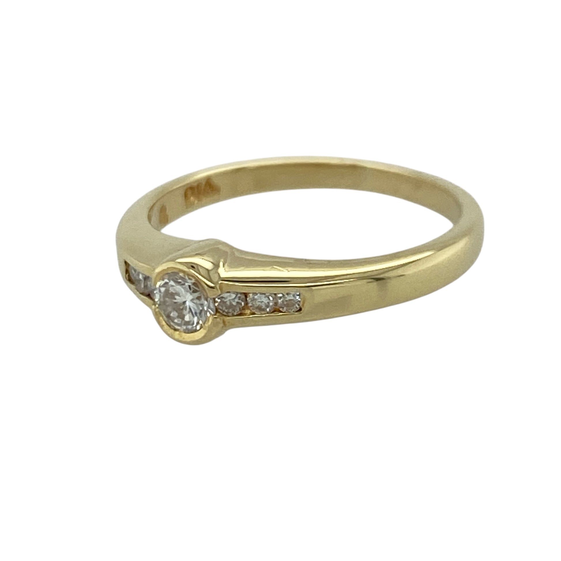 Add timeless elegance and refined sparkle to your jewellery collection with this pre-owned 18ct yellow gold diamond set solitaire ring, featuring a classic centre stone design enhanced with diamond-set shoulders—perfect for engagements, anniversaries, or sophisticated everyday wear.

Design: The ring showcases a sparkling centre diamond complemented by three smaller diamonds set on each side, creating a beautifully balanced and elegant look.