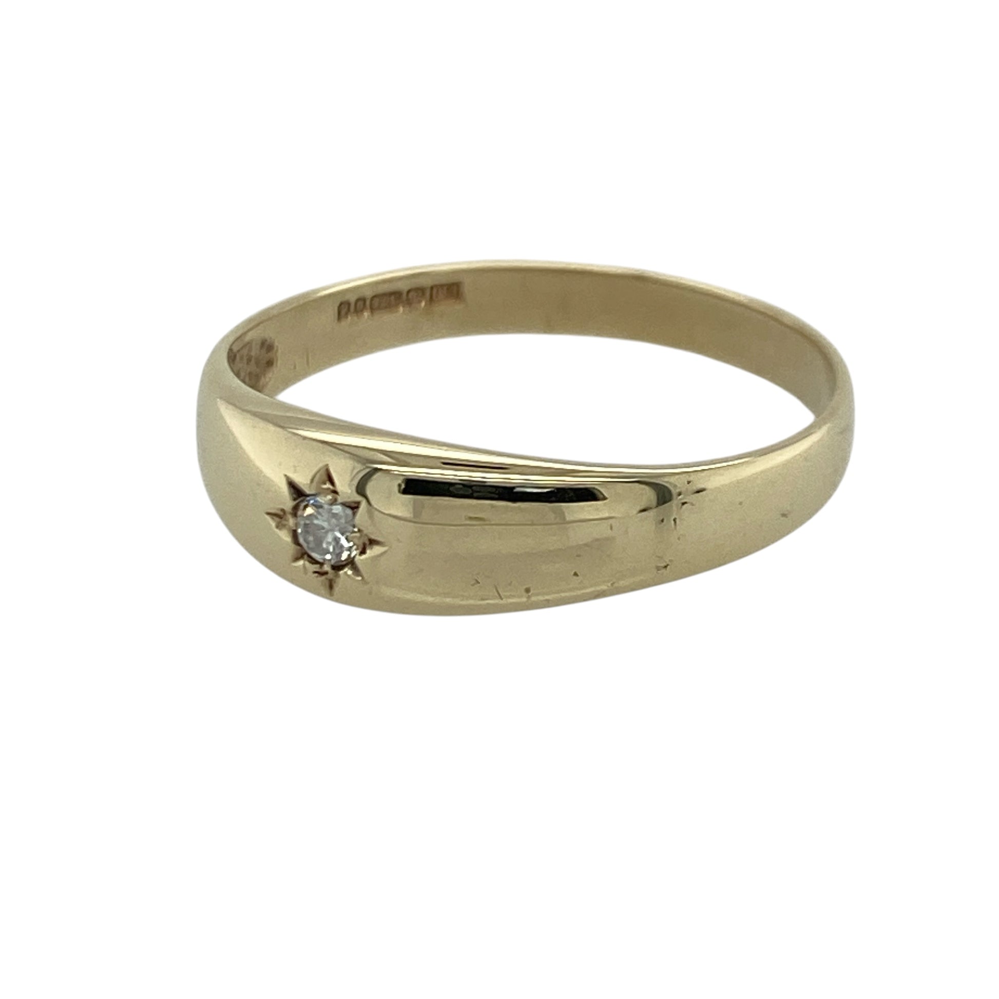 Add timeless sparkle and contemporary style to your jewellery collection with this pre-owned 9ct yellow gold diamond set solitaire band ring, featuring a sleek wide band design with elegant everyday appeal—perfect for gifting, special occasions, or sophisticated daily wear.

Design: The ring features a polished band design measuring approximately 6mm wide at the front, highlighted by a sparkling solitaire diamond of approximately 0.05ct.