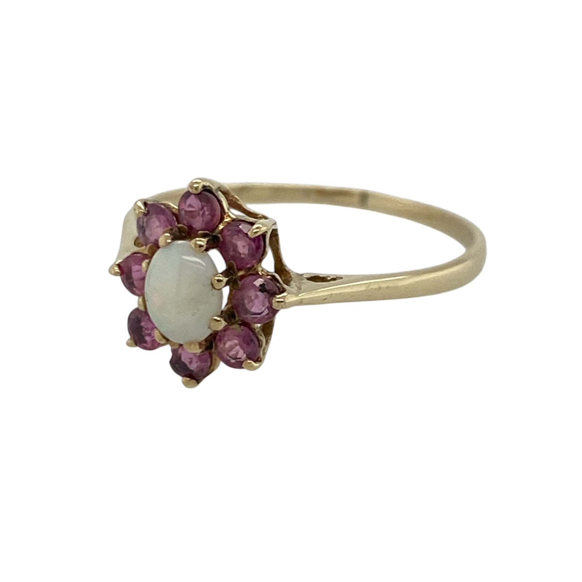 Add delicate colour and vintage-inspired charm to your jewellery collection with this pre-owned 9ct yellow gold opalique and ruby flower cluster ring, featuring a beautiful floral design with timeless feminine appeal—perfect for special occasions, gifting, or elegant everyday wear.

Design: The ring showcases an oval opalique centre stone measuring approximately 5mm by 4mm, surrounded by vibrant ruby accents in a flower cluster arrangement that creates a graceful and eye-catching appearance.