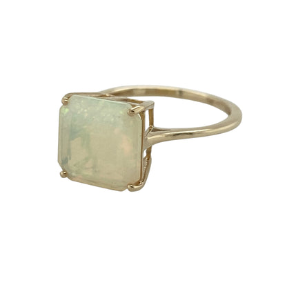 Add elegant shimmer and timeless style to your jewellery collection with this pre-owned 9ct yellow gold opalique square ring, featuring a striking geometric gemstone design with sophisticated everyday appeal—perfect for special occasions, gifting, or adding a touch of colour to your jewellery collection.

Design: The ring showcases a beautiful square opalique stone measuring approximately 10mm by 10mm, creating a bold and eye-catching focal point with its luminous appearance and contemporary shape.