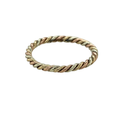 Add timeless elegance and versatile styling to your jewellery collection with this pre-owned 9ct yellow, white and rose gold twisted band ring, featuring a beautiful tri-colour design with classic everyday appeal—perfect for stacking, gifting, or effortless daily wear.

Design: The ring features an elegant twisted band design combining yellow, white, and rose gold strands, creating a distinctive tri-colour effect with timeless charm.
