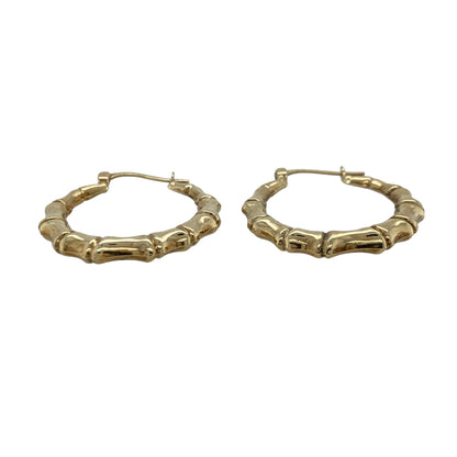 Add timeless style and distinctive texture to your jewellery collection with these pre-owned 9ct yellow gold bamboo creole earrings, featuring a classic hoop design inspired by natural bamboo detailing—perfect for everyday wear, gifting, or effortless occasion styling.

Design: The earrings feature a traditional creole hoop design with bamboo-inspired detailing throughout, creating a textured and eye-catching look. Measuring approximately 27mm in diameter