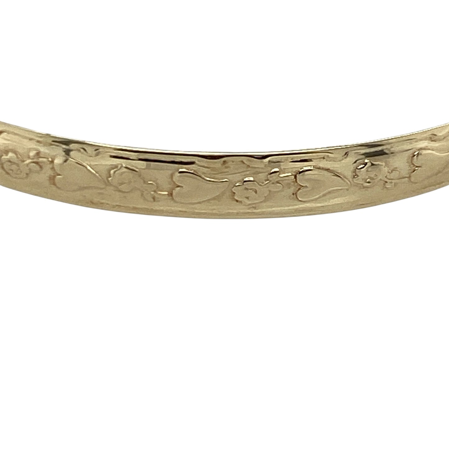 Celebrate a precious milestone with this pre-owned 9ct yellow gold flower and heart patterned baby bangle, featuring charming decorative detailing and timeless sentimental appeal—perfect as a christening gift, birthday present, or treasured keepsake.

Design: The bangle features an attractive pattern of flowers and hearts engraved around the surface, creating a sweet and decorative design with lasting charm. The band measures approximately 4mm wide, offering a delicate yet durable appearance.
