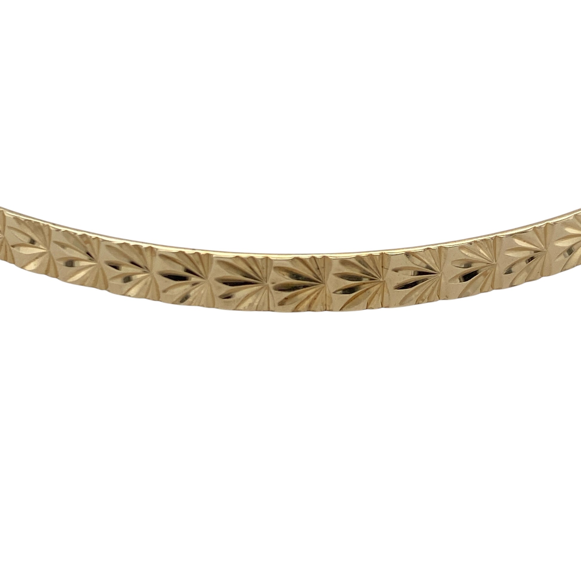 Add timeless elegance to your jewellery collection with this pre-owned 9ct yellow solid gold patterned bangle, featuring classic decorative detailing and versatile everyday appeal—perfect for stacking, gifting, or sophisticated daily wear.

Design: The bangle features an attractive patterned finish that catches the light beautifully, adding texture and character to the classic gold bangle design. Measuring approximately 4mm wide, it offers a refined and elegant appearance.